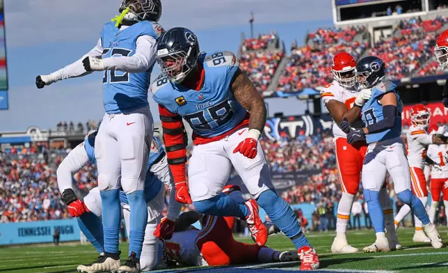 Tennessee Titans defensive tackle Jeffery Simmons (98) celebrates after tackling Kansas City Chiefs running back Kareem Hunt for a safety during the first half of an NFL football game, Sunday, Dec. 21, 2025, in Nashville, Tenn. (AP Photo/John Amis)