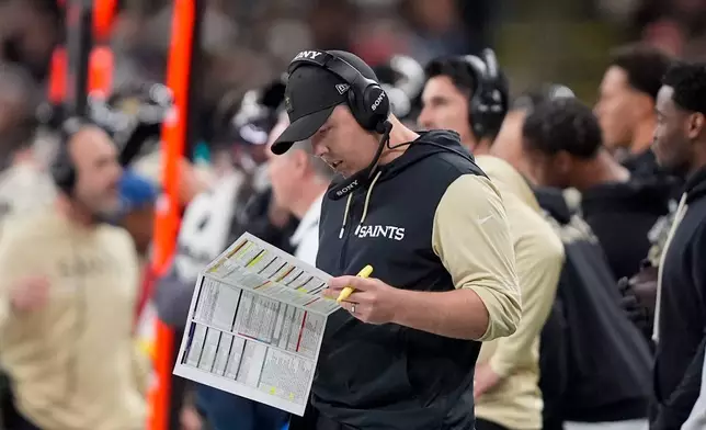 New Orleans Saints head coach Kellen Moore stands on the sideline during the second half of an NFL football game against the New York Jets, Sunday, Dec. 21, 2025, in New Orleans. (AP Photo/Gerald Herbert)