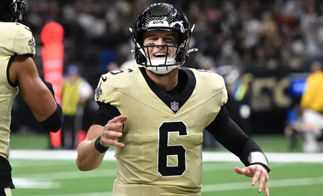 New Orleans Saints quarterback Tyler Shough celebrates after a touchdown during the second half of an NFL football game against the New York Jets, Sunday, Dec. 21, 2025, in New Orleans. (AP Photo/Ella Hall)