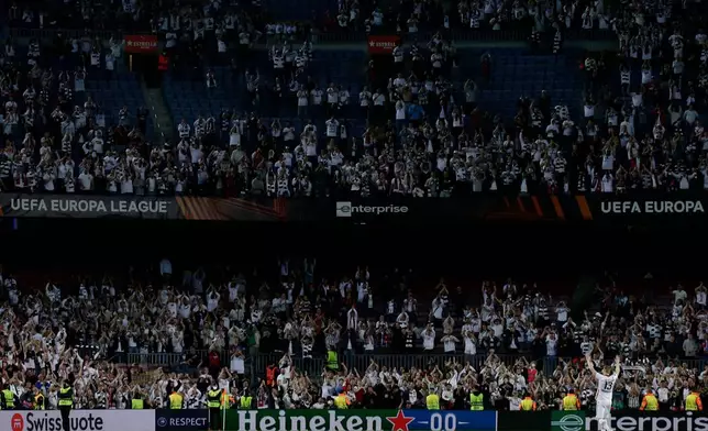 FILE - Frankfurt's Martin Hinteregger applauds fans after winning the Europa League, second leg, quarterfinal soccer match against Barcelona at the Camp Nou stadium, in Barcelona, Spain, Thursday, April 14, 2022. (AP Photo/Joan Monfort, file)