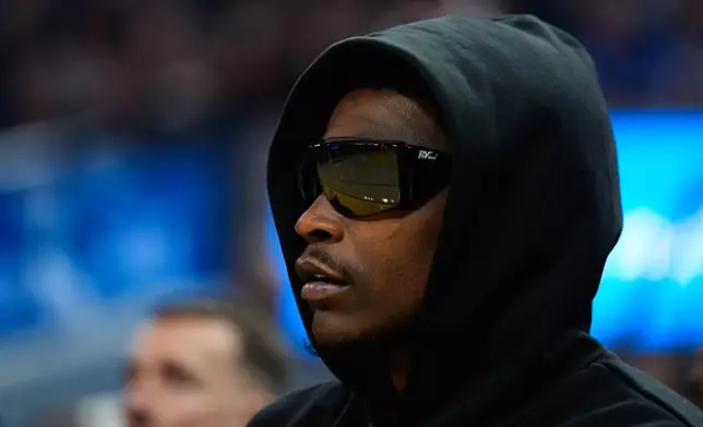 Minnesota Timberwolves guard Anthony Edwards watches from the bench during the first half of an NBA basketball game against the Golden State Warriors, Friday, Dec. 12, 2025, in San Francisco. (AP Photo/Godofredo A. Vásquez)