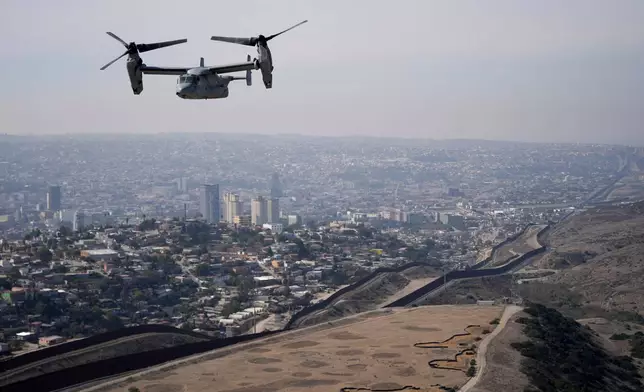A U.S. Marine Osprey is flown over the border, Jan. 31, 2025, near San Diego. (AP Photo/Jae C. Hong, File)