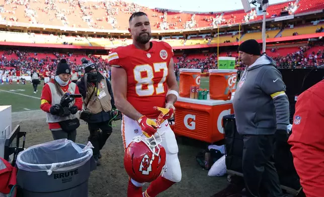 Kansas City Chiefs tight end Travis Kelce heads off the field following an NFL football game against the Los Angeles Chargers Sunday, Dec. 14, 2025, in Kansas City, Mo. (AP Photo/Ed Zurga)