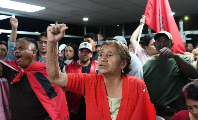 Supporters cheer for the ruling party presidential candidate Rixi Moncada at the party's headquarters in Tegucigalpa, Honduras, Monday, Dec. 1, 2025. (AP Photo/Moises Castillo)