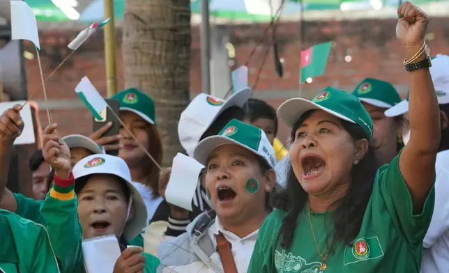 Supporters of the military-backed Union Solidarity and Development Party (USDP) cheer during the final day of campaign for the first phase of a general election in Naypyitaw, Myanmar, Friday, Dec. 26, 2025. (AP Photo/Aung Shine Oo)