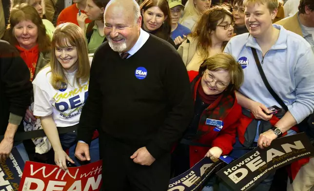 FILE - Actor and director Rob Reiner, center, poses for photographs while stumping along with actor Martin Sheen, not seen, for Democratic presidential hopeful Howard Dean, Jan. 14, 2004, at the University of Northern Iowa, in Cedar Falls, Iowa. (Rick Chase/The Courier via AP, File)