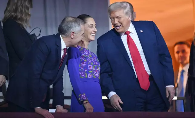 President Donald Trump speaks with Canadian Prime Minister Mark Carney and Mexican President Claudia Sheinbaum after the draw for the 2026 soccer World Cup at the Kennedy Center in Washington, Friday, Dec. 5, 2025. (Mandel Ngan/Pool Photo via AP)