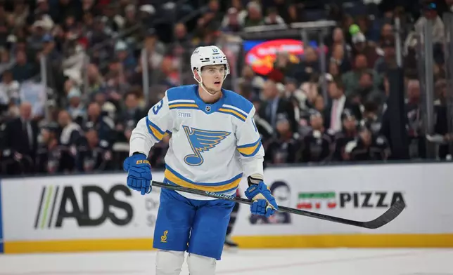 FILE - St. Louis Blues forward Alexei Toropchenko skates during an NHL hockey game against the Columbus Blue Jackets in Columbus, Ohio, Nov. 1, 2025. (AP Photo/Paul Vernon, File)