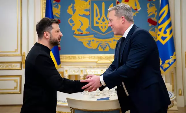 FILE - In this photo provided by the Ukrainian president's office, President Volodymyr Zelenskyy, left, shakes hands with U.S. Army Secretary Dan Driscoll in Kyiv, Ukraine, on Nov. 20, 2025. (Ukrainian Presidential Press Office via AP, File)