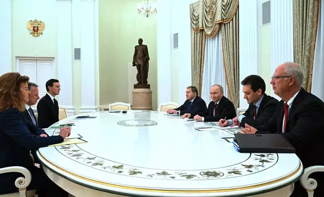 FILE - Russian President Vladimir Putin, third from right, Russian Presidential Foreign Policy Adviser Yuri Ushakov, fourth from right, and Russian Direct Investment Fund CEO Kirill Dmitriev, right, attend talks with U.S. special envoy Steve Witkoff, second from left, and Jared Kushner, U.S. President Donald Trump's son-in-law, third, at the Kremlin in Moscow, Russia, Dec. 2, 2025. (Kristina Kormilitsyna/Sputnik, Kremlin Pool Photo via AP, File)