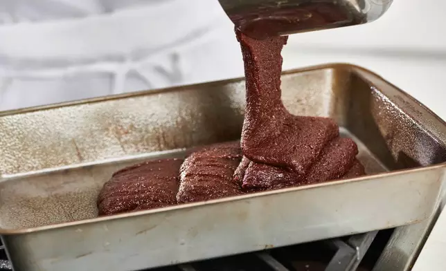 Brownie batter is poured into a pan in New York on Oct. 7, 2020. (Cheyenne M. Cohen via AP)