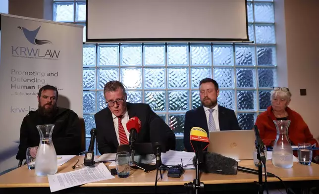 Kevin Winters of KRW Law, second left, speaking to the media at the Stormont Hotel in Belfast, Tuesday, Dec. 9, 2025, following the publication of the final Kenova report. (Liam McBurney/PA via AP)
