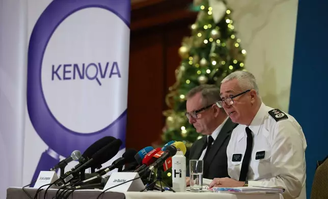 Kenova chief Iain Livingstone, left, and Police Service of Northern Ireland (PSNI) Chief Constable Jon Boutcher speak to the media at the Stormont Hotel, in Belfast, Tuesday, Dec. 9, 2025, following the publication of the final Kenova report. (Liam McBurney/PA via AP)