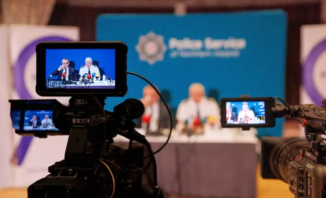 Kenova chief Iain Livingstone, left, and Police Service of Northern Ireland (PSNI) Chief Constable Jon Boutcher speak to the media at the Stormont Hotel, in Belfast, Tuesday, Dec. 9, 2025, following the publication of the final Kenova report. (Liam McBurney/PA via AP)