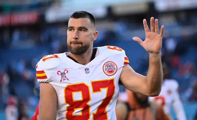 Kansas City Chiefs tight end Travis Kelce waves to fans as he walks off the field after an NFL football game against the Tennessee Titans, Sunday, Dec. 21, 2025, in Nashville, Tenn. (AP Photo/John Amis)