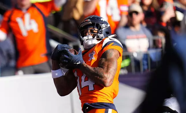 Denver Broncos wide receiver Courtland Sutton makes a catch to score a touchdown against the Jacksonville Jaguars during the first half of an NFL football game in Denver, Sunday, Dec. 21, 2025. (AP Photo/Jack Dempsey)