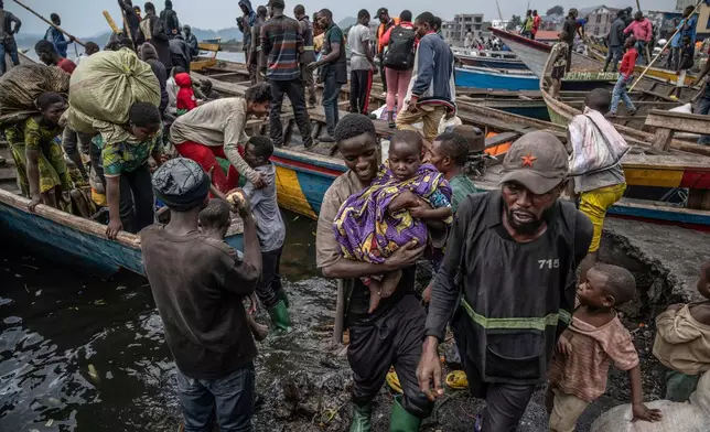 People fleeing M-23 rebel advances arrive by boat in Goma, Democratic Republic of the Congo, Jan. 22, 2025. (AP Photo/Moses Sawasawa, File)