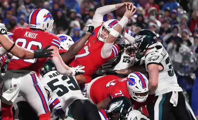 Buffalo Bills' Josh Allen (17) scores a touchdown during the second half of an NFL football game against the Philadelphia Eagles, Sunday, Dec. 28, 2025, in Buffalo, N.Y. (AP Photo/Gene J. Puskar)