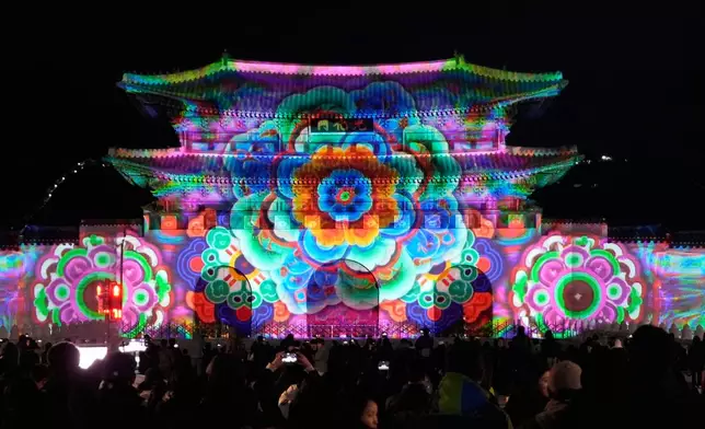 FILE - Media art illuminates the facade of Gwanghwamun, the main gate of the 14th-century Gyeongbok Palace, during Seoul Winter Festa in Seoul, South Korea, Dec. 12, 2025. (AP Photo/Ahn Young-joon, File)