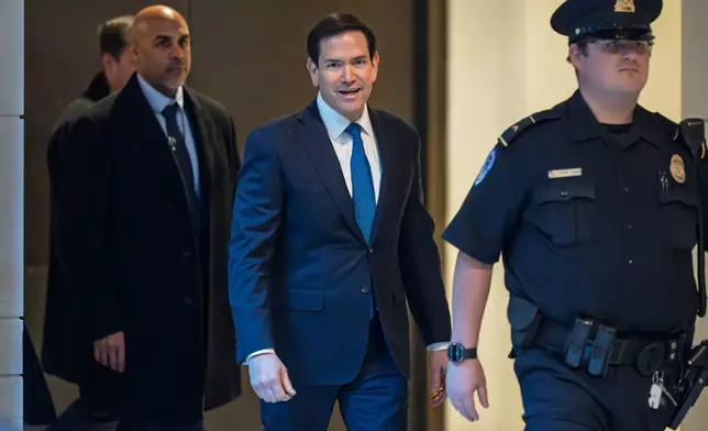 Secretary of State Marco Rubio arrives to join Defense Secretary Pete Hegseth in a secure room in the basement of the Capitol to brief lawmakers on the military strike on a suspected drug smuggling boat and its crew in the Caribbean near Venezuela Sept. 2, at the Capitol in Washington, Tuesday, Dec. 9, 2025. (AP Photo/J. Scott Applewhite)