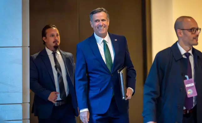 CIA Director John Ratcliffe walks to a secure room in the basement of the Capitol to join Defense Secretary Pete Hegseth to brief lawmakers on how he handled a military strike on a suspected drug smuggling boat and its crew in the Caribbean near Venezuela Sept. 2, in Washington, Tuesday, Dec. 9, 2025. (AP Photo/J. Scott Applewhite)