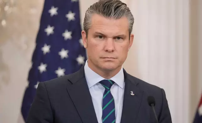 Defense Secretary Pete Hegseth listens during news conference with Australia's Deputy Prime Minister and Defense Minister Richard Marles, Australia's Foreign Minister Penny Wong and Secretary of State Marco Rubio at the State Department, Monday, Dec. 8, 2025, in Washington. (AP Photo/Mark Schiefelbein)