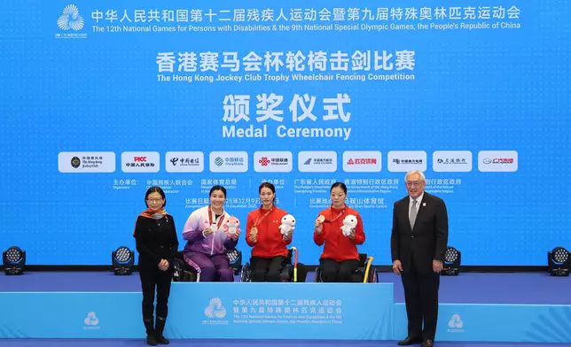 Hong Kong Jockey Club Steward Anita Fung (1st left) presents medals to winners of Women's Individual Épée Category A at The Hong Kong Jockey Club Trophy Wheelchair Fencing Competition of the 12th National Games for Persons with Disabilities and the 9th National Special Olympic Games. Hong Kong wheelchair fencer Yu Chui-yee (2nd right) won a silver medal in the competition.