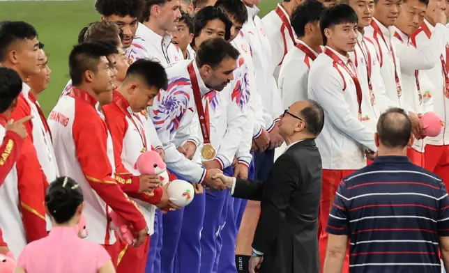 Hong Kong Jockey Club Chairman The Hon Martin Liao presents gold medals to the Hong Kong team, winers of The Hong Kong Jockey Club Trophy Rugby Sevens Competition at the 15th National Games.