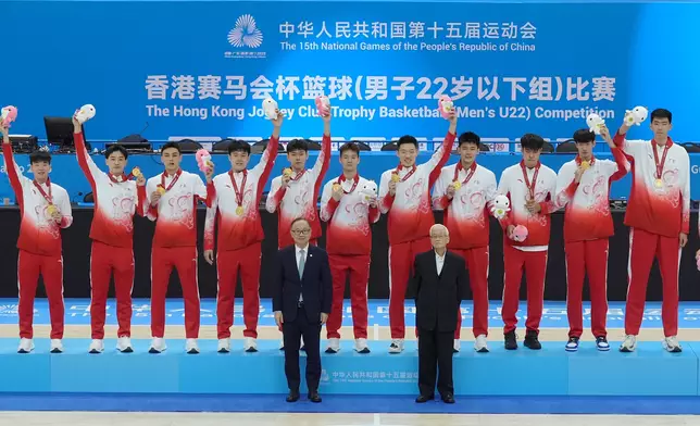 Hong Kong Jockey Club Chairman The Hon Martin Liao (front row, left ) presents medals to winning teams taking part in The Hong Kong Jockey Club Trophy Basketball (Men’s U22) Competition at the 15th National Games.
