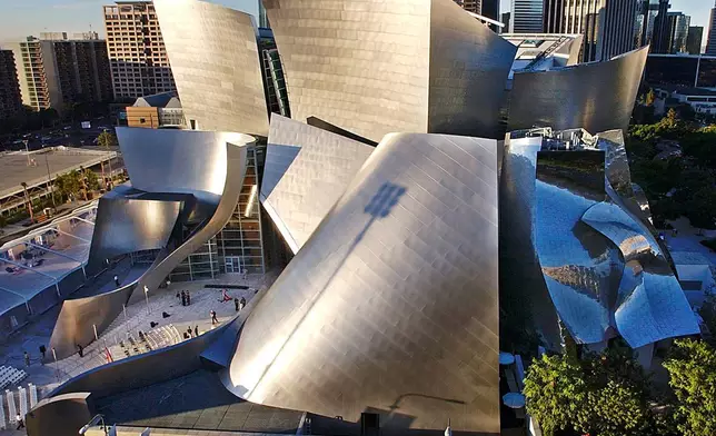 FILE - This Oct. 20, 2003 file photo shows early morning sun illuminating the new Walt Disney Concert Hall in downtown Los Angeles. (AP Photo/Nick Ut, file)