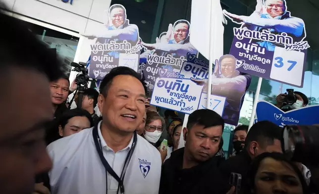 Thailand's Prime Minister and leader of Bhumjaithai Party Anutin Charnvirakul leaves after a drawing at a candidate registration in Bangkok, Thailand, Sunday, Dec. 28, 2025.