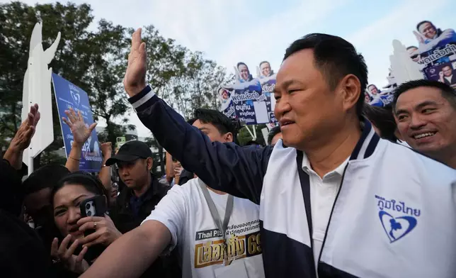 Thailand's Prime Minister and leader of Bhumjaithai Party Anutin Charnvirakul, front right, arrives for a canddate registration in Bangkok, Thailand, Sunday, Dec. 28, 2025. (AP Photo/Sakchai Lalit)