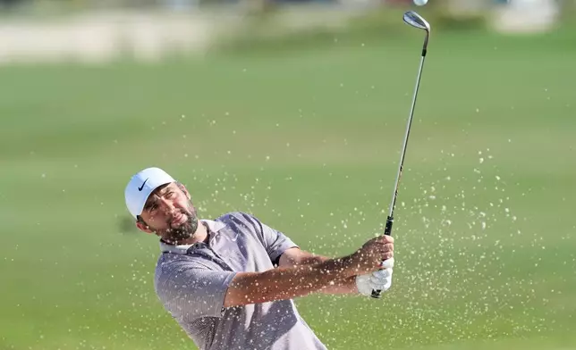 Scottie Scheffler, of the United States, hits from the bunker on the 10th hole during the final round of the Hero World Challenge PGA Tour at the Albany Golf Club, in New Providence, Bahamas, Sunday, Dec. 7, 2025. (AP Photo/Fernando Llano)