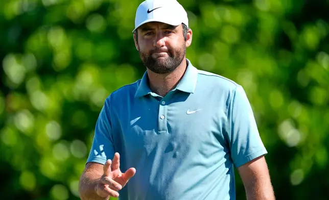 Scottie Scheffler, of the United States, reacts to making a birdie on the fourth hole during the third round of the Hero World Challenge PGA Tour at the Albany Golf Club, in New Providence, Bahamas, Saturday, Dec. 6, 2025. (AP Photo/Fernando Llano)