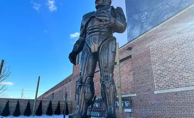 A statue of RoboCop stands outside a business in Detroit's Eastern Market area, Thursday, Dec. 4, 2025. (AP Photo/Mike Householder)