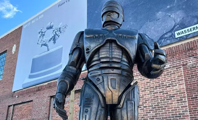 A statue of RoboCop stands outside a business in Detroit's Eastern Market area, Thursday, Dec. 4, 2025. (AP Photo/Mike Householder)