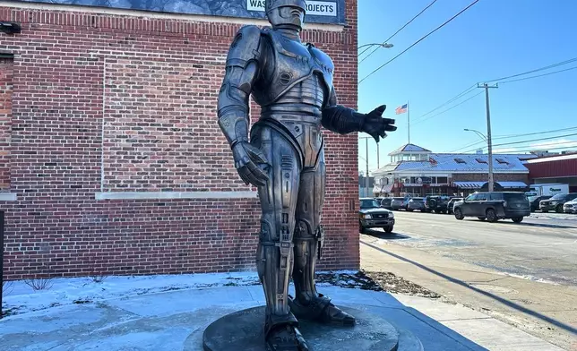 A statue of RoboCop stands outside a business in Detroit's Eastern Market area, Thursday, Dec. 4, 2025. (AP Photo/Mike Householder)