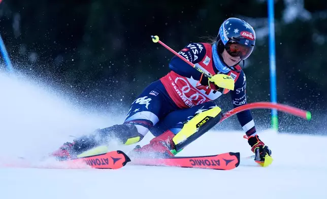 United States' Mikaela Shiffrin speeds down the course during an alpine ski, women's World Cup slalom in Semmering, Austria, Sunday, Dec. 28, 2025. (AP Photo/Giovanni Auletta)