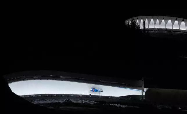Luge athlete Walter Vikstrom from Finland takes a practice run in Lake Placid, N.Y., Wednesday, Dec. 17, 2025. (AP Photo/Seth Wenig)