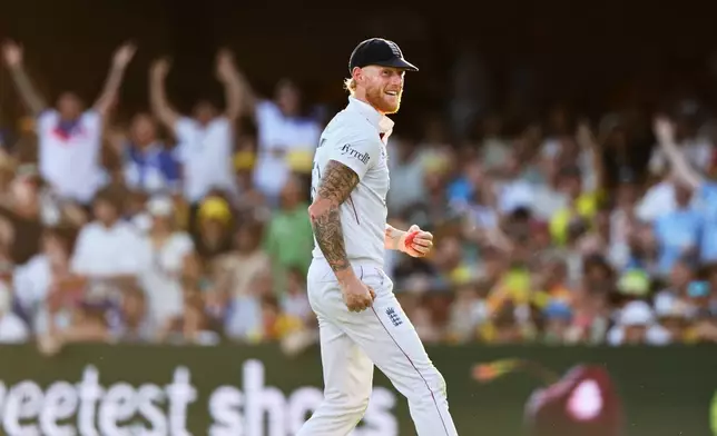 England's captain Ben Stokes celebrates the wicket of Australia's Mitchell Starc during the second Ashes cricket test match between Australia and England in Brisbane, Saturday, Dec. 6, 2025.. (AP Photo/Tertius Pickard)