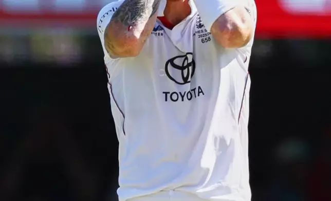 England's captain Ben Stokes reacts after bowls a delivery during the second Ashes cricket test match between Australia and England in Brisbane, Saturday, Dec. 6, 2025.. (AP Photo/Tertius Pickard)
