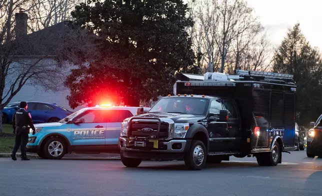 An FBI truck departs the street where the FBI made an arrest and are investigating a house in Woodbridge, Va., Thursday, Dec. 4, 2025. (AP Photo/Cliff Owen)