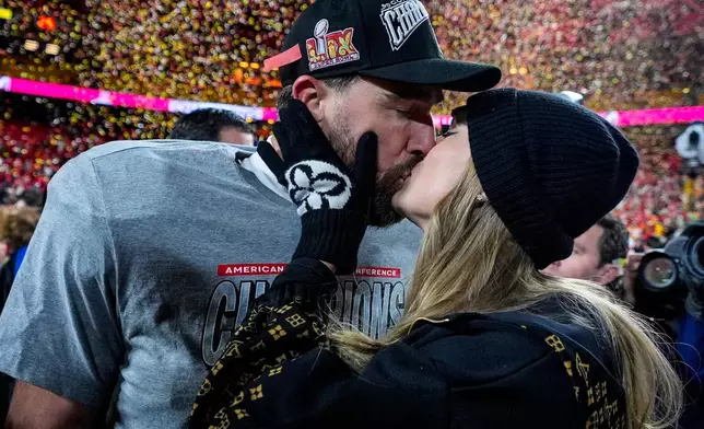 Kansas City Chiefs tight end Travis Kelce and Taylor Swift kiss after the AFC Championship NFL football game against the Buffalo Bills, in Kansas City, Mo., Jan. 26, 2025. (AP Photo/Ashley Landis, File)