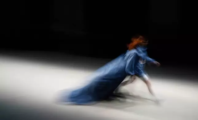 A model walks on a runway wearing a creation by Russian brand AP Design on a runway at Fashion Week in Moscow, March 13, 2025. (AP Photo/Pavel Bednyakov, File)