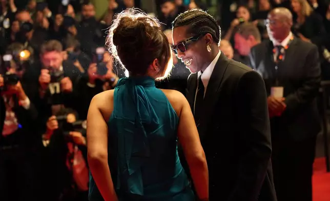 Rihanna, left, and A$AP Rocky pose for photographers upon their departure from the premiere of the film 'Highest 2 Lowest' at the 78th international film festival, Cannes, southern France, May 19, 2025. (Photo by Lewis Joly/Invision/AP File)