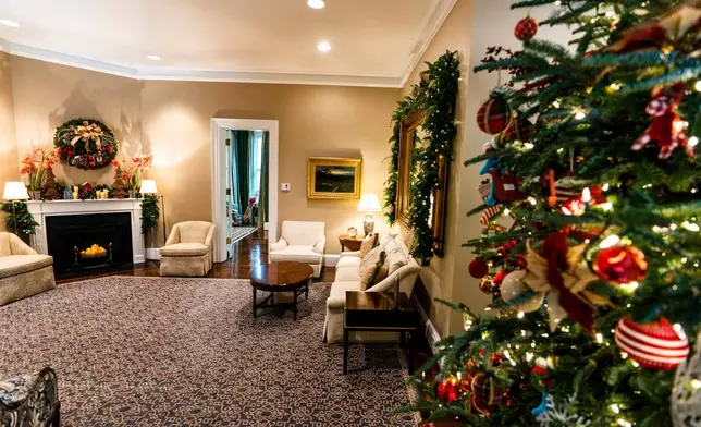 FILE - The vice president's official residence living room is decorated with a Christmas tree featuring whimsical old fashioned toys and a Christmas wreath above a fireplace Monday, Nov. 30, 2020 in Washington. (AP Photo/Manuel Balce Ceneta, File)