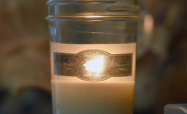 FILE - This Nov. 1, 2017 photos shows a scented candle produced by Bristol, Tenn., resident Jessie Duckett at her home business. (Andre Teague/Bristol Herald Courier via AP, File)