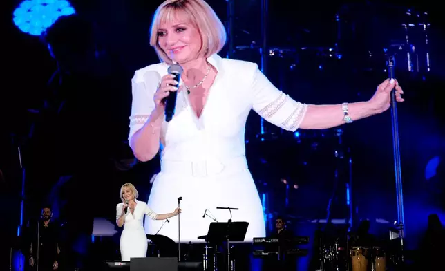 FILE - Iranian pop star Googoosh performs during a concert at the Dubai Expo 2020, in Dubai, United Arab Emirates, March 17, 2022. (AP Photo/Ebrahim Noroozi, File)
