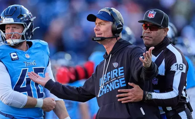 Tennessee Titans interim head coach Mike McCoy questions a call during the second half of an NFL football game against the Kansas City Chiefs, Sunday, Dec. 21, 2025, in Nashville, Tenn. (AP Photo/George Walker IV)