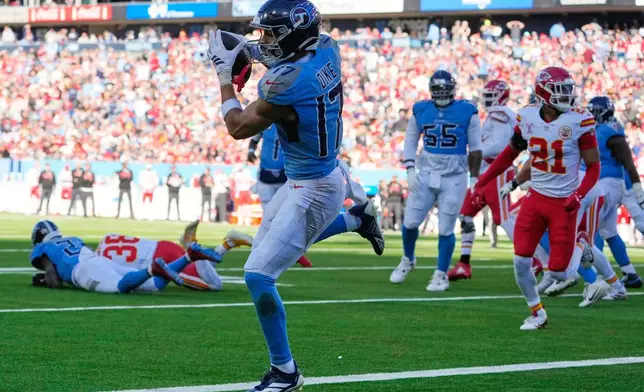 Tennessee Titans wide receiver Chimere Dike catches a pass to score a touchdown during the first half of an NFL football game against the Kansas City Chiefs, Sunday, Dec. 21, 2025, in Nashville, Tenn. (AP Photo/George Walker IV)